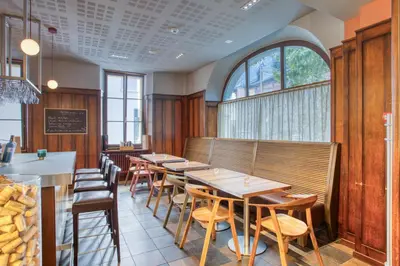 Ein Sitzbereich in der Unterkunft Hôtel Au Terminus