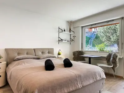 Ein Bett oder Betten in einem Zimmer der Unterkunft Studio Marmotta - Zermatt