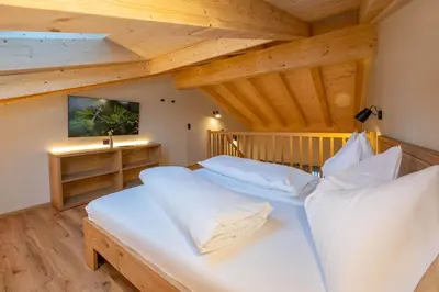 Ein Bett oder Betten in einem Zimmer der Unterkunft Mountain Lodge