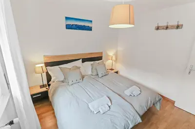 Ein Bett oder Betten in einem Zimmer der Unterkunft Magnifique appartement à côté des remontées mécaniques