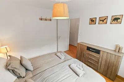 Ein Bett oder Betten in einem Zimmer der Unterkunft Magnifique appartement à côté des remontées mécaniques