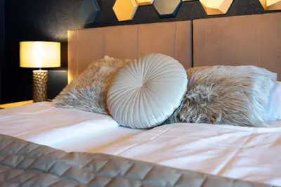 Ein Bett oder Betten in einem Zimmer der Unterkunft The Glacier Express Apartment - GRINDELHOMES