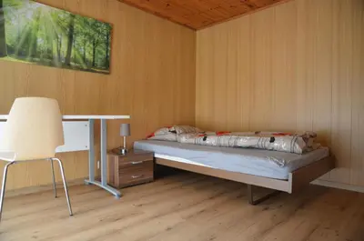 Ein Bett oder Betten in einem Zimmer der Unterkunft Grosse, schöne Wohnung im Grünen