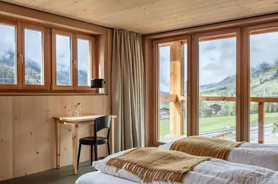 Ein Bett oder Betten in einem Zimmer der Unterkunft Berglodge Goms (Hotel)