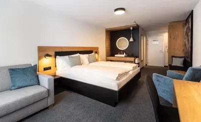 Ein Bett oder Betten in einem Zimmer der Unterkunft Hotel Piz Badus