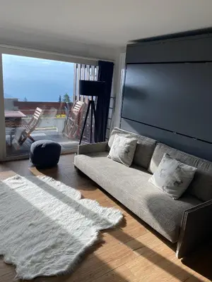 Ein Sitzbereich in der Unterkunft Magnifique studio à Anzère avec vue sur les montagnes