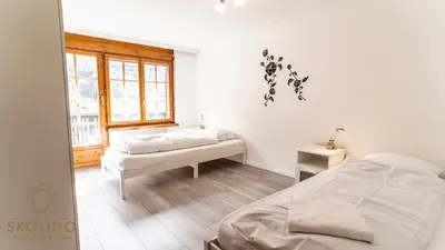 Ein Bett oder Betten in einem Zimmer der Unterkunft Gemütliches Ferienhaus Brigerbad