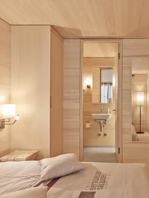 Ein Bett oder Betten in einem Zimmer der Unterkunft Bergwelten Salwideli