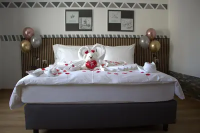 Ein Bett oder Betten in einem Zimmer der Unterkunft Hotel Arkanum