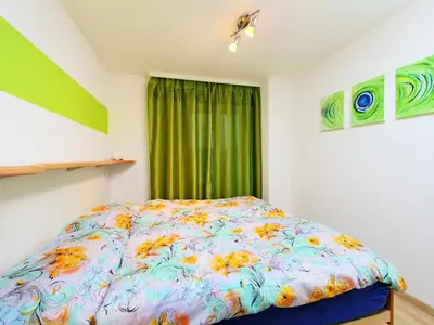 Ein Bett oder Betten in einem Zimmer der Unterkunft Apartment Sonnhalde B by Interhome