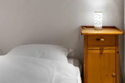 Ein Bett oder Betten in einem Zimmer der Unterkunft Les Antilles l Bucolique l By CosyHome
