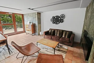 Ein Sitzbereich in der Unterkunft Charmant studio ouvert avec vue paisible