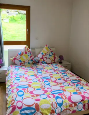 Ein Bett oder Betten in einem Zimmer der Unterkunft La Chaumière d'Hérens