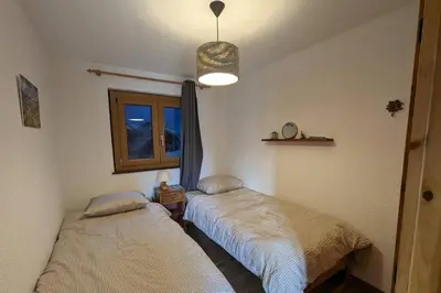 Ein Bett oder Betten in einem Zimmer der Unterkunft Chalet Cactus - 4 Vallées