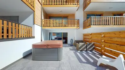 Ein Sitzbereich in der Unterkunft Spacieux appart - 2 chambres à coucher incl Jacuzzi Privé