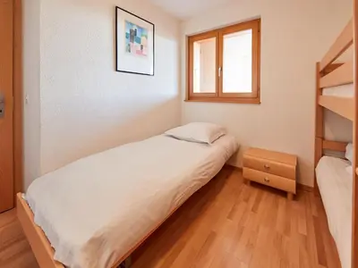 Ein Bett oder Betten in einem Zimmer der Unterkunft Apartment Sérandes-4 by Interhome