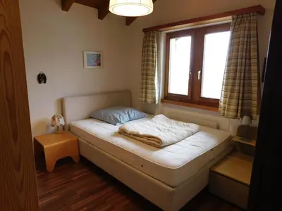 Ein Bett oder Betten in einem Zimmer der Unterkunft Ferienwohnung Silberdistel 2. Obergeschoss