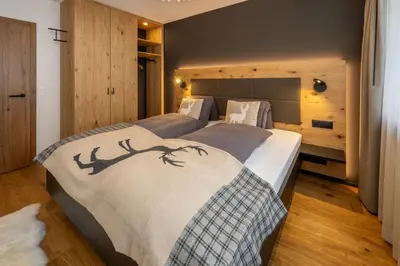 Ein Bett oder Betten in einem Zimmer der Unterkunft Seventh Sky - the luxury one by Inspring Places Zermatt