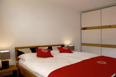 Ein Bett oder Betten in einem Zimmer der Unterkunft Apartment Olympia Matterhorn