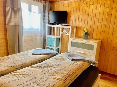 Ein Bett oder Betten in einem Zimmer der Unterkunft stunning panoramic views! Hottube & Sauna