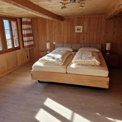 Ein Bett oder Betten in einem Zimmer der Unterkunft Meieli's Chalet