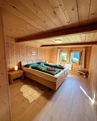 Ein Bett oder Betten in einem Zimmer der Unterkunft Meieli's Chalet