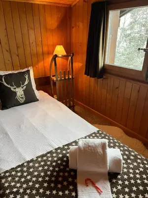 Ein Bett oder Betten in einem Zimmer der Unterkunft Chalet atypique Colorado Crans-Montana