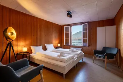 Ein Bett oder Betten in einem Zimmer der Unterkunft Chalet Seehus Iseltwald