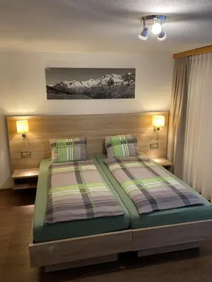 Ein Bett oder Betten in einem Zimmer der Unterkunft Apartments Arcadia