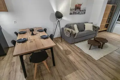 Ein Sitzbereich in der Unterkunft Appartement rénové avec vue panoramique et sauna