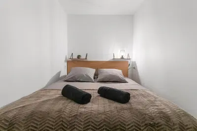 Ein Bett oder Betten in einem Zimmer der Unterkunft Appartement rénové avec vue panoramique et sauna