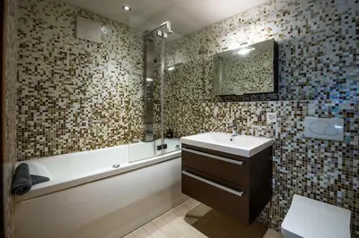 Ein Badezimmer in der Unterkunft Modern & ruhig mit Matterhornblick by ZermattStays