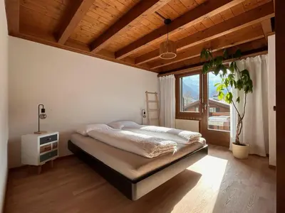 Ein Bett oder Betten in einem Zimmer der Unterkunft Apartment Chalet Ilge by Interhome