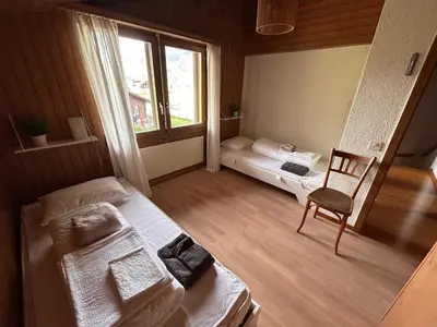 Ein Bett oder Betten in einem Zimmer der Unterkunft Apartment Chalet Ilge by Interhome