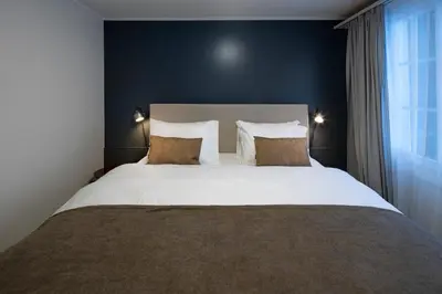 Ein Bett oder Betten in einem Zimmer der Unterkunft Hotel Bergidyll - Riders Haven