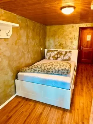 Ein Bett oder Betten in einem Zimmer der Unterkunft Swiss Lodge Joopi