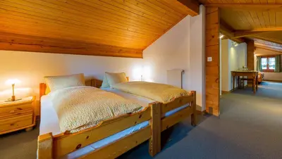 Ein Bett oder Betten in einem Zimmer der Unterkunft Swiss Lodge Joopi