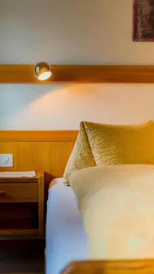 Ein Bett oder Betten in einem Zimmer der Unterkunft Swiss Lodge Joopi