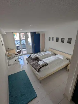 Ein Bett oder Betten in einem Zimmer der Unterkunft Alpina Peaks