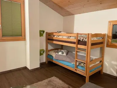 Ein Bett oder Betten in einem Zimmer der Unterkunft Chalet Sträba