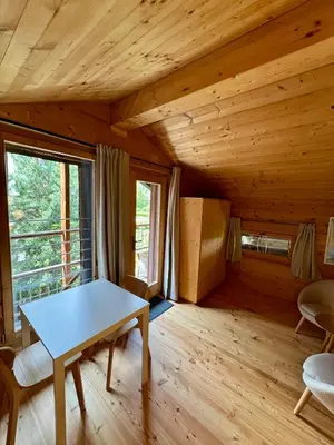 Ein Bett oder Betten in einem Zimmer der Unterkunft Les Mazots du Hameau - Charme Alpin avec Cuisine équipée