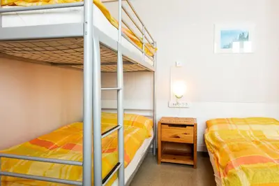 Ein Bett oder Betten in einem Zimmer der Unterkunft Happy Inn Lodge