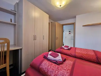 Ein Bett oder Betten in einem Zimmer der Unterkunft Felskinn 2. OG