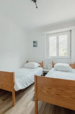 Ein Bett oder Betten in einem Zimmer der Unterkunft Appartement avec vue majestueuse sur les montagnes