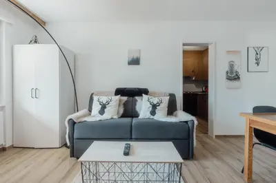 Ein Sitzbereich in der Unterkunft Appartement avec vue majestueuse sur les montagnes