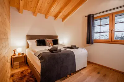 Ein Bett oder Betten in einem Zimmer der Unterkunft Chalet Marmo by HomeFlow