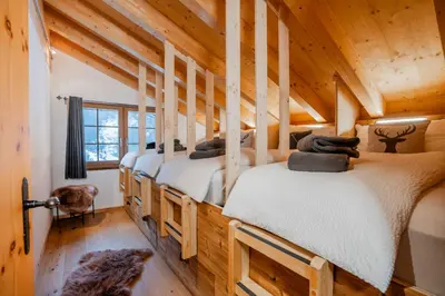 Ein Bett oder Betten in einem Zimmer der Unterkunft Chalet Marmo by HomeFlow