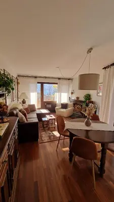 Ein Sitzbereich in der Unterkunft Charmant appartement avec vue sur les montagnes