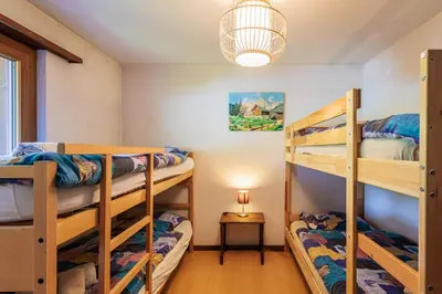 Ein Bett oder Betten in einem Zimmer der Unterkunft Arnica 1 - 6 pers - piscine