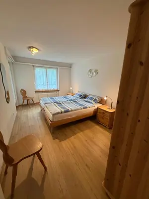 Ein Bett oder Betten in einem Zimmer der Unterkunft Saas-Fee Swiss Vacances